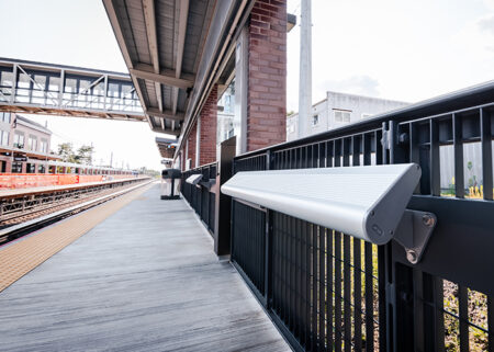 An image depicting a style of hostile architecture colloquially known as a 'leaning rail'. These rails have replaced seating on many NSW train stations.